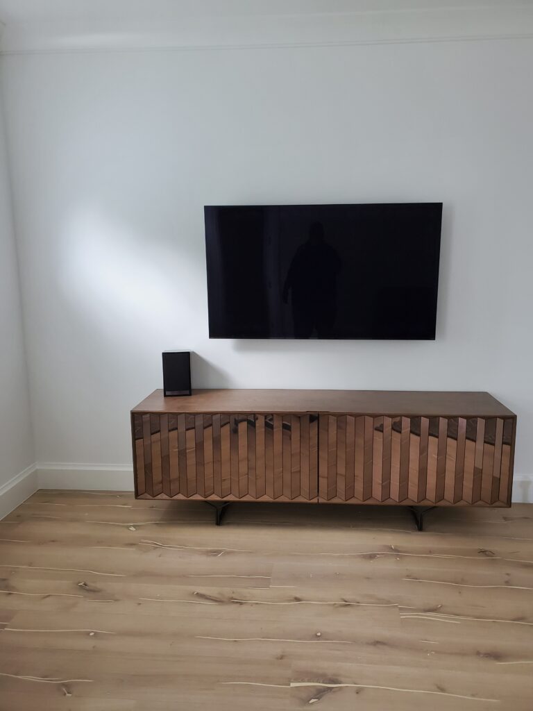 TV mounted on wall with hidden cable installation